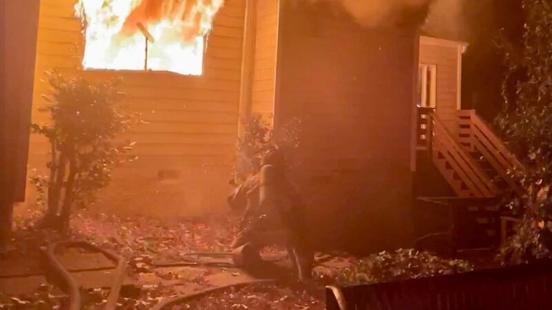 Firefighters rescued an elderly woman and a K-9 from a house fire in Lithonia Saturday...