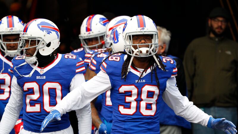 Buffalo Bills defensive back Sergio Brown (38) and Corey Graham (20) walk toward the field...