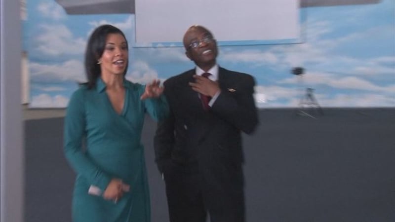 Retired Delta Air Lines Captain John Bailey with CBS46 Anchor Tracye Hutchins.