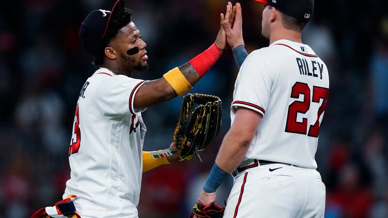 Atlanta Braves right fielder Ronald Acuna Jr., left, and third baseman Austin Riley celebrate...