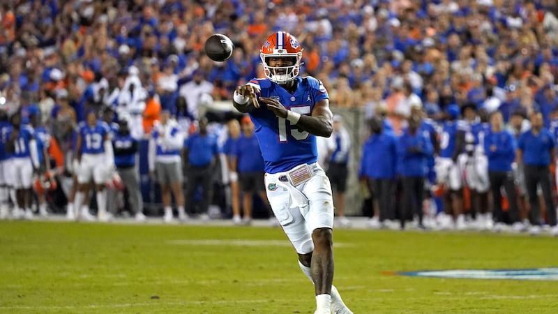 Florida quarterback Anthony Richardson throws a pass during the first half of an NCAA college...