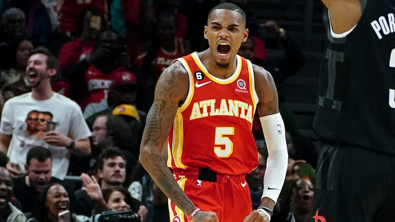 Atlanta Hawks guard Dejounte Murray reacts after a basket against the Houston Rockets during...