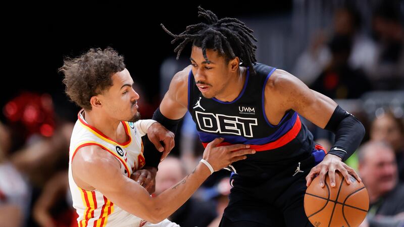 Detroit Pistons guard Jaden Ivey, right, drives against Atlanta Hawks guard Trae Young during...