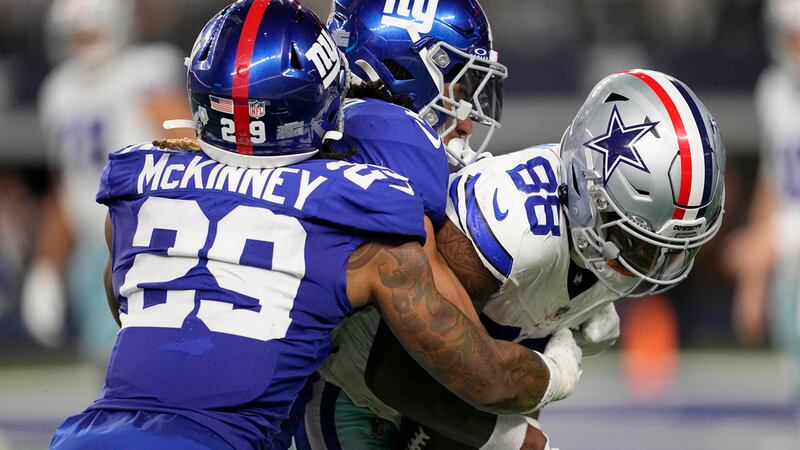 Dallas Cowboys wide receiver CeeDee Lamb (88) catches a pass and is hit by New York Giants...
