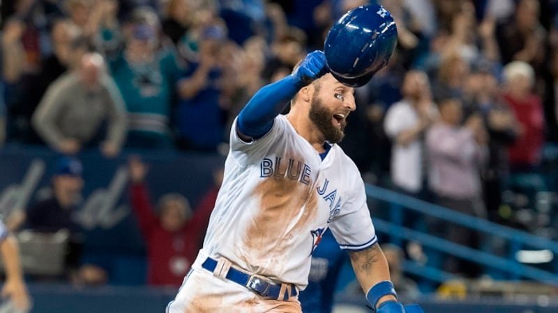Toronto Blue Jays Kevin Pillar reacts after crossing home plate on a single by catcher Luke...