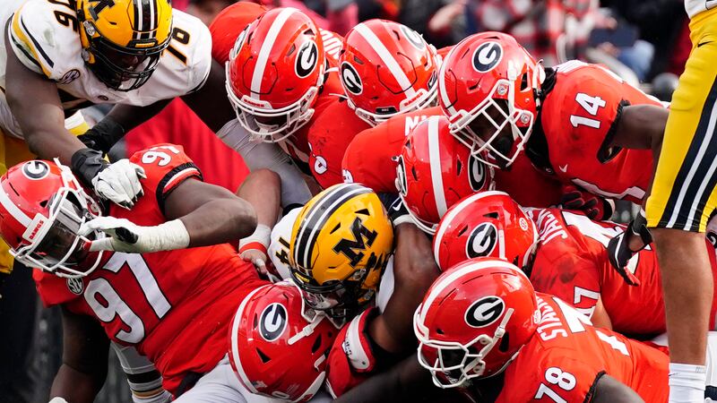 Missouri running back BJ Harris (14) is stopped by the Georgia defense in the second half of a...