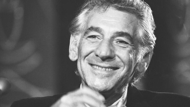 FILE - In this July 26, 1971 file photo conductor Leonard Bernstein tells reporters in...