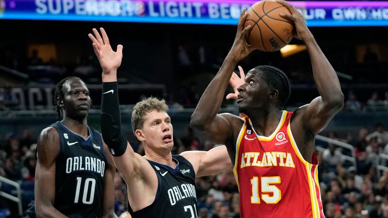 Atlanta Hawks' Clint Capela (15) looks for a shot against Orlando Magic's Moritz Wagner,...