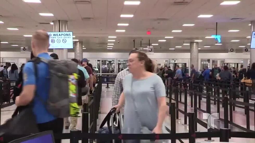 Passengers walk through the security queue at Hartsfield-Jackson Atlanta International Airport.