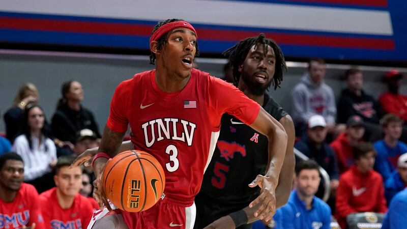 UNLV forward Donovan Williams (3) works against SMU guard Emmanuel Bandoumel, right, during an...
