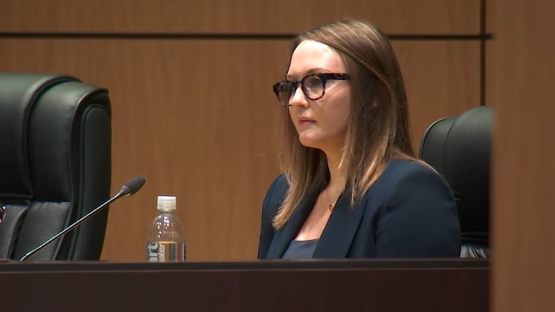 Katie Rinderle as she took the stand Thursday morning in her termination hearing at the school...