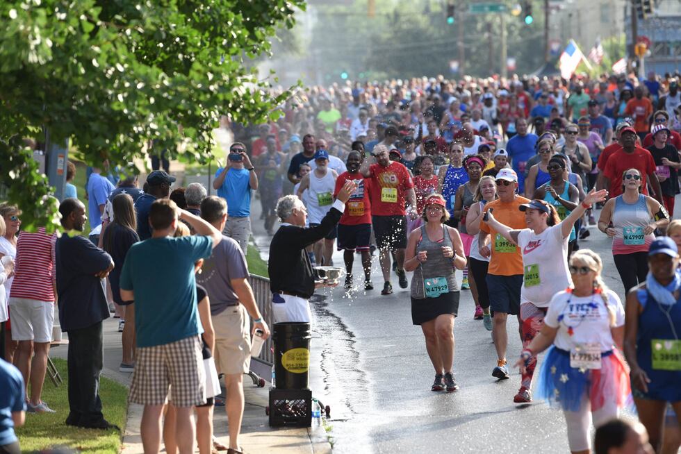Rev. Sam Candler blesses runners at the Peachtree Road Race