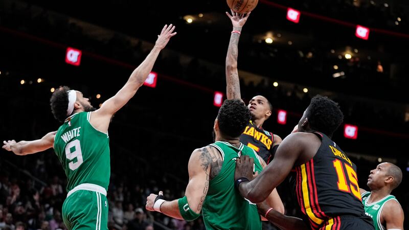 Atlanta Hawks guard Dejounte Murray (5) shoots and scores against the Boston Celtics during...