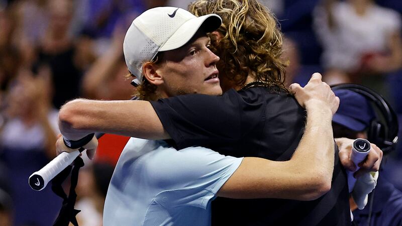 Jannik Sinner, of Italy, hugs Alexander Zverev, of Germany, after Zverev won their match...