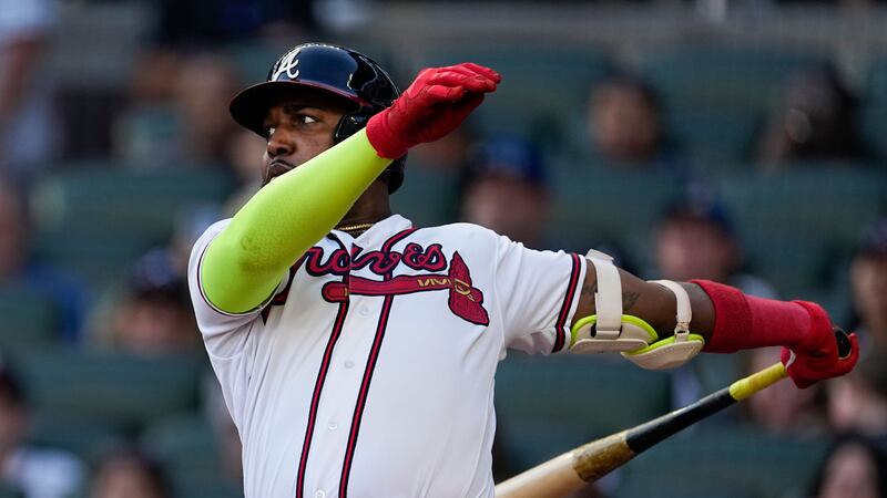 Atlanta Braves designated hitter Marcell Ozuna hits a solo home run in the ninth inning of a...
