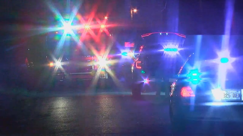 Police respond to a scene with lights and sirens on.