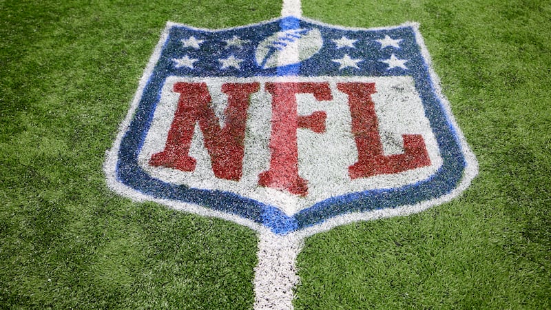 FILE - The NFL logo is shown on the field during an NFL football game, Sunday, Dec. 5, 2021,...