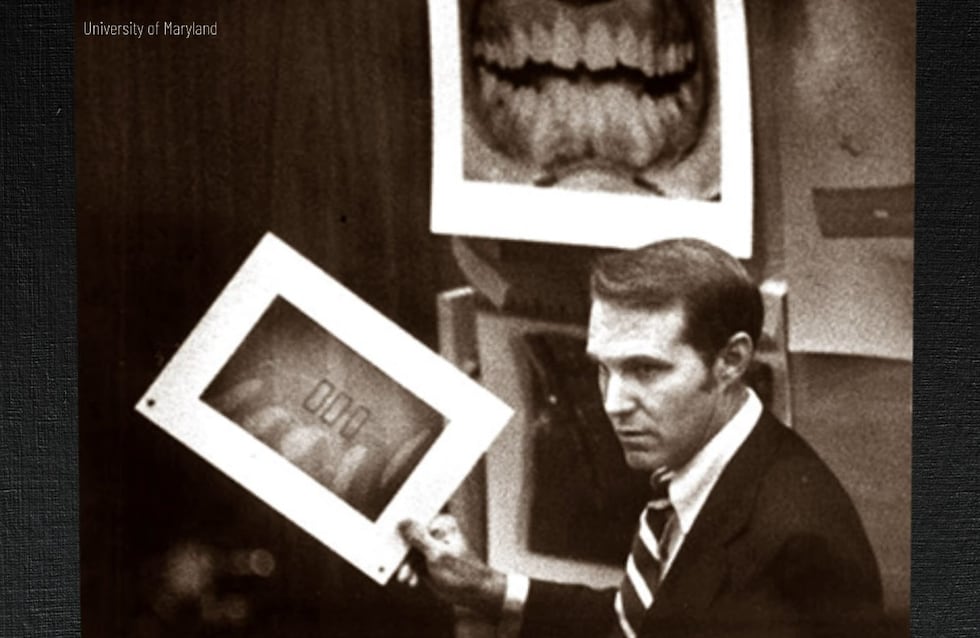 A photo of Dr. Richard Souviron presenting bitemark analysis evidence.